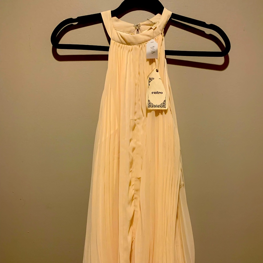Perfect church or special occasion cream colored pleated & boutique dress